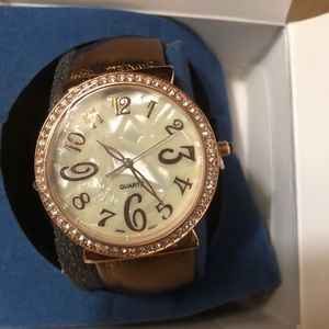 Avon metallic cuff watch bronzetone